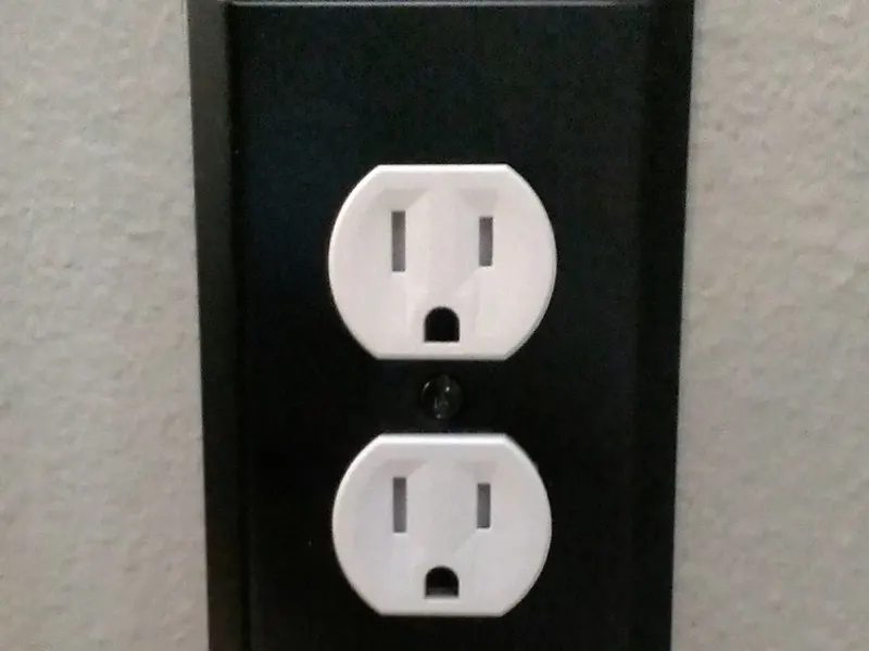 Close-up of a covered electrical wall socket