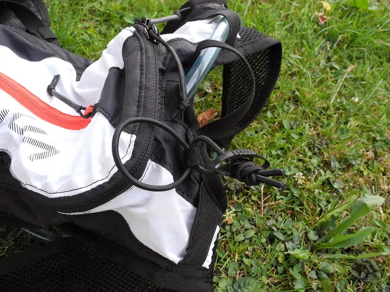 Changing backpack lying open on the grass
