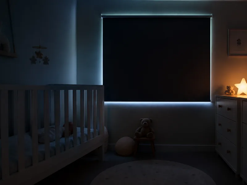 Nursery window covered with a blackout blind in soft darkness