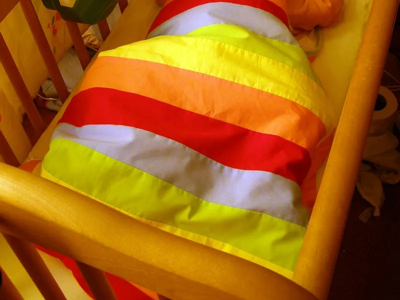 Colourful baby sleeping bag fabric close up