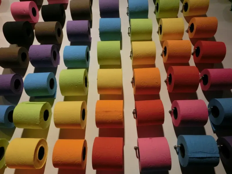 Rows of colourful toilet paper rolls
