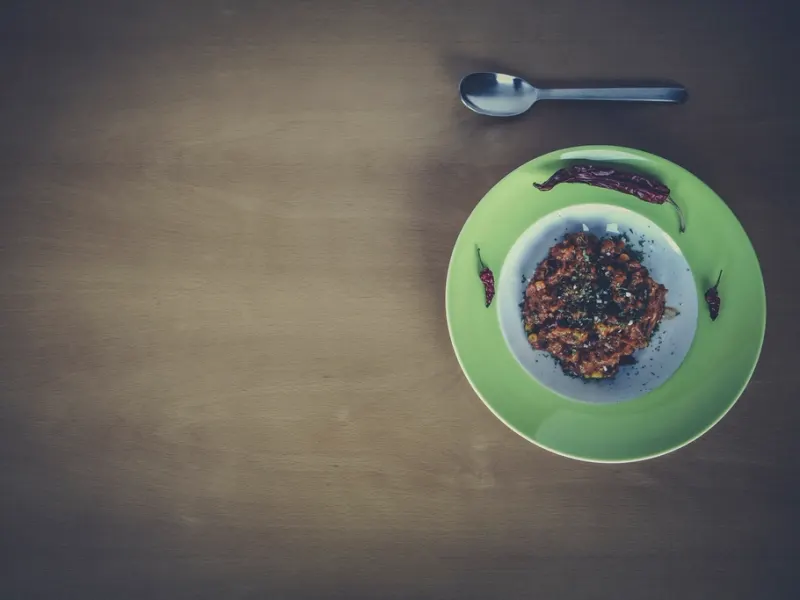 Bowl of chilli con carne on a plate