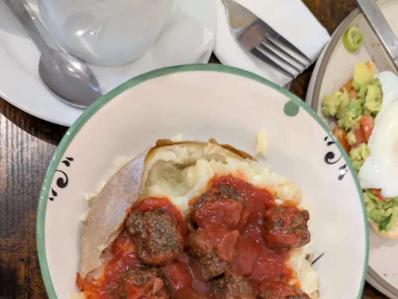 Meatballs in tomato sauce served with mashed potato