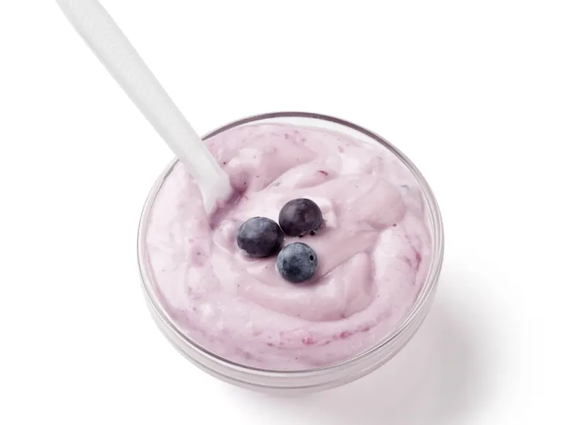 Bowl of yogurt topped with blueberries