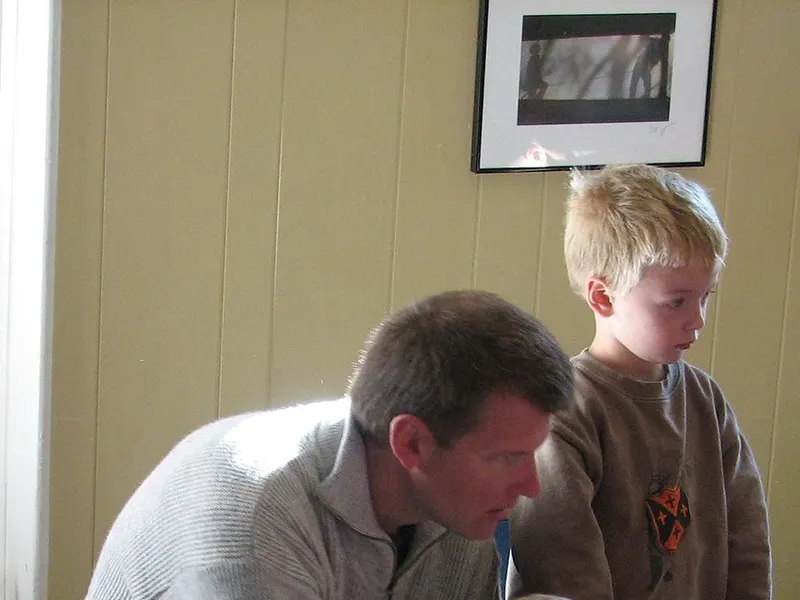 Father talking calmly with his young son
